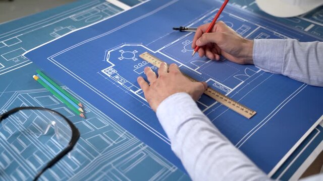 Civil engineer makes amendments to the construction plan of the house
