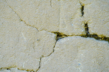 Clay wall with cracks in the structure