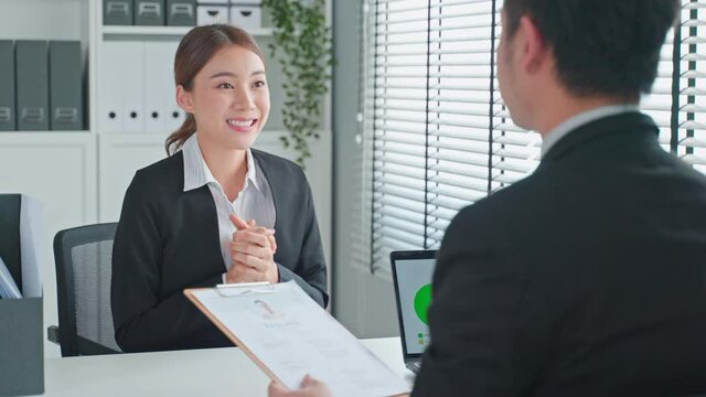 Asian woman handshake with hr manager after job interview in office. 