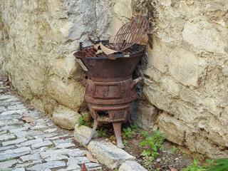 Old vintage barbecue in a street of an old Provencal village.