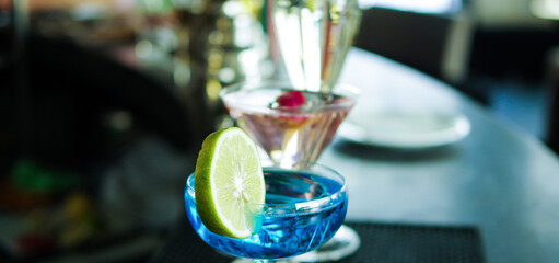 colorful fruit flavor cocktail glasses on bar counter table