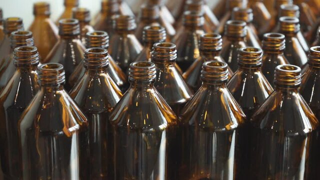 Small medicine bottles medicine container.  A close-up view of small amber bottles with white caps