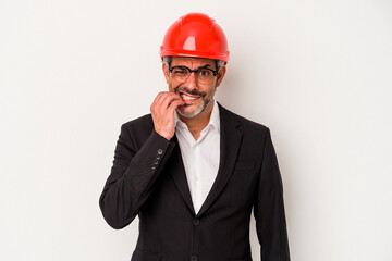 Middle age architect caucasian man isolated on white background  biting fingernails, nervous and very anxious.