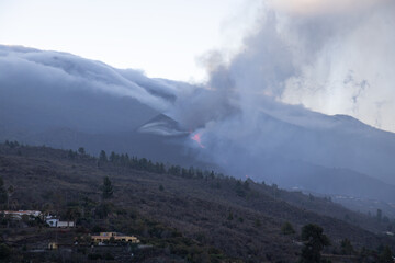 2021 Cumbre Vieja volcanic eruption (seen at morning from far) on the island of La Palma, one of...