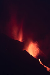 2021 Cumbre Vieja volcanic eruption (seen at night) on the island of La Palma, one of the Canary...