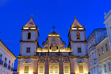 Fototapeta na wymiar Illuminated facade of an ancient and historic church located in Salvador, Bahia in the Pelourinho district at dusk