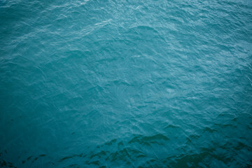 Aerial view of ripple sea waves. Turquoise sea texture with waves. Water sea or ocean for background
