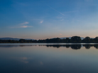 sunset over the lake with blue sky