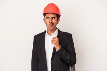 Young architect mixed race man isolated on white background confused, feels doubtful and unsure.