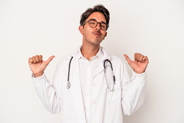 Young mixed race doctor man isolated on white background feels proud and self confident, example to follow.