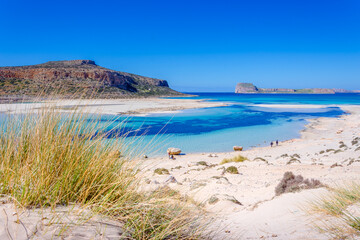 Fototapeta na wymiar Amazing view of Balos Lagoon with magical turquoise waters, lagoons, tropical beaches of pure white sand and Gramvousa island on Crete, Greece