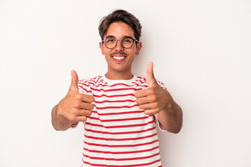 Young mixed race man isolated on white background smiling and raising thumb up