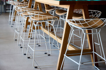 Several white stools on the table in a living room