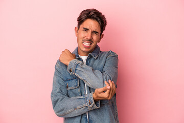 Young mixed race man isolated on white background massaging elbow, suffering after a bad movement.