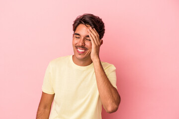 Young mixed race man isolated on white background joyful laughing a lot. Happiness concept.