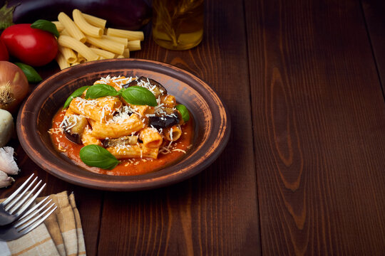 pasta alla norma with eggplant ricotta tomato sauce copy space