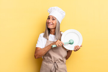 senior gray hair woman. washing dishes concept