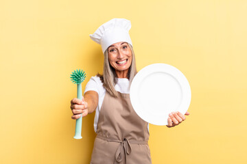 senior gray hair woman. washing dishes concept