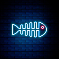 Obraz premium Glowing neon line Fish skeleton icon isolated on brick wall background. Fish bone sign. Colorful outline concept. Vector