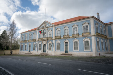 Fototapeta na wymiar Palace of Queluz facade with portuguese flag - Queluz, Portugal