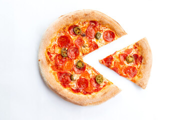 Pizza with pepperoni and jalapenos. A piece is cut off.