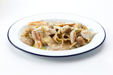 Chicken pasta on a plate.
