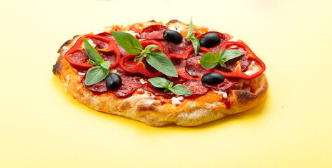 Roman pizza with pepperoni and olives.