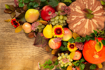 Autumn harvest, fruits and vegetables on a wooden background. Thanksgiving or harvest holiday concept.