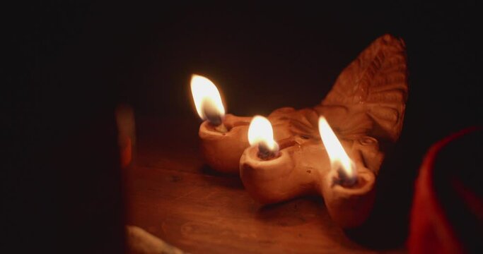 Antique Roman Empire style rushlight in darkness.