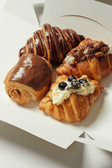 Four different fill of croissant in the box - soft focus