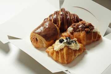 Four different fill of croissant in the box - soft focus