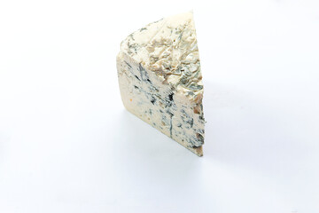 A piece of blue cheese. Isolated on white.