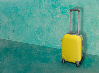 Yellow travel case on green background