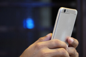 using mobile phone and background with beautiful light