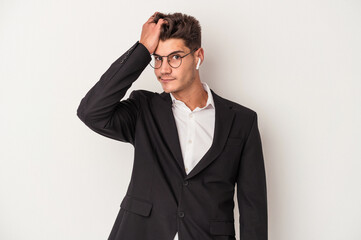 Young business caucasian man wearing headphones isolated on white background being shocked, she has remembered important meeting.