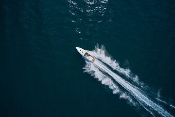 Speed boat faster movement on the water top view. Speedboat movement on the water. Speedboat wave...