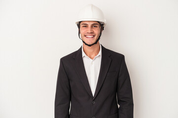 Young architect caucasian man isolated on white background happy, smiling and cheerful.