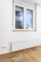 Fototapeta na wymiar Smart heater convector. Smart Home with the smart heating system. Electric panel heating concept.
