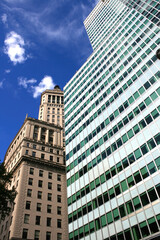 Fototapeta na wymiar Looking up at the modern facade of corporate skyscrapers in New York Manhattan. New York, USA