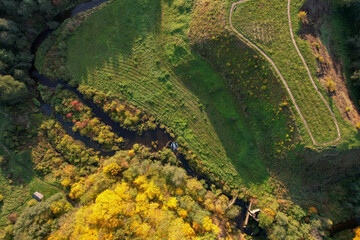 Top of the baltic mound with beautiful colors of autumn photographed with a drone on sunny day. Regional park of neris in Lithuania. Dukstai educational trail. Real is beautiful  