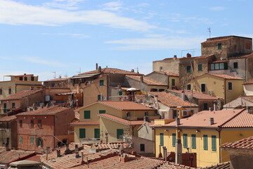Elba, Italy &ndash; September 02, 2021: beautiful places from Elba Island. Aerial  view to the island. Little famous villages near the beaches. Summer tourist places. Clouds and blue sky in the background.