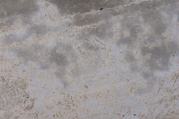 The texture of a gray concrete wall. The background of old cement plaster. Gray wall surface