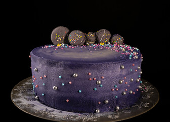 Handmade purple cake with french macarons decorations