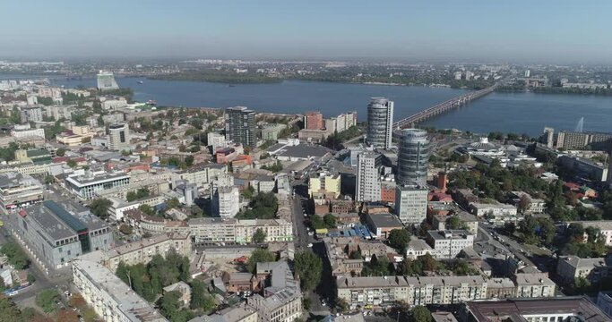 Eastern european city from the air. Dnipro city from the air. Flying over the old city near the river. A city on the dnieper river.