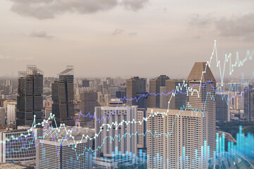Market behavior graph hologram, sunset panoramic city view of Singapore, popular location to achieve financial degree in Southeast Asia. The concept of financial data analysis. Double exposure.