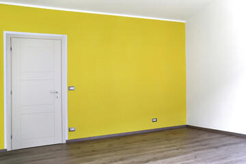 Empty interior with modern door, wall painted yellow and and wooden floor