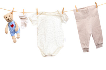 Baby clothes on a clothesline on white  background