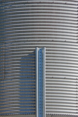 Full frame close-up view of the corrugated metal surface of a large grain silo 