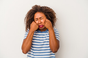 Young african american woman with curly hair isolated on white background whining and crying disconsolately.