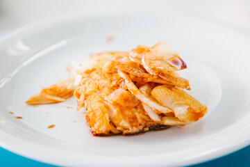 Mediterranean food concept. Fried fish on the white plate.